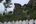 a stone wall with a fence