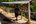 a man standing in front of a row of containers