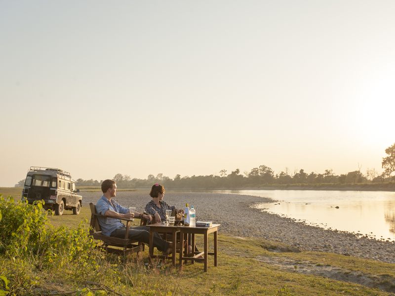 Couple at sunset with jeep