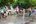 a group of people playing with water guns