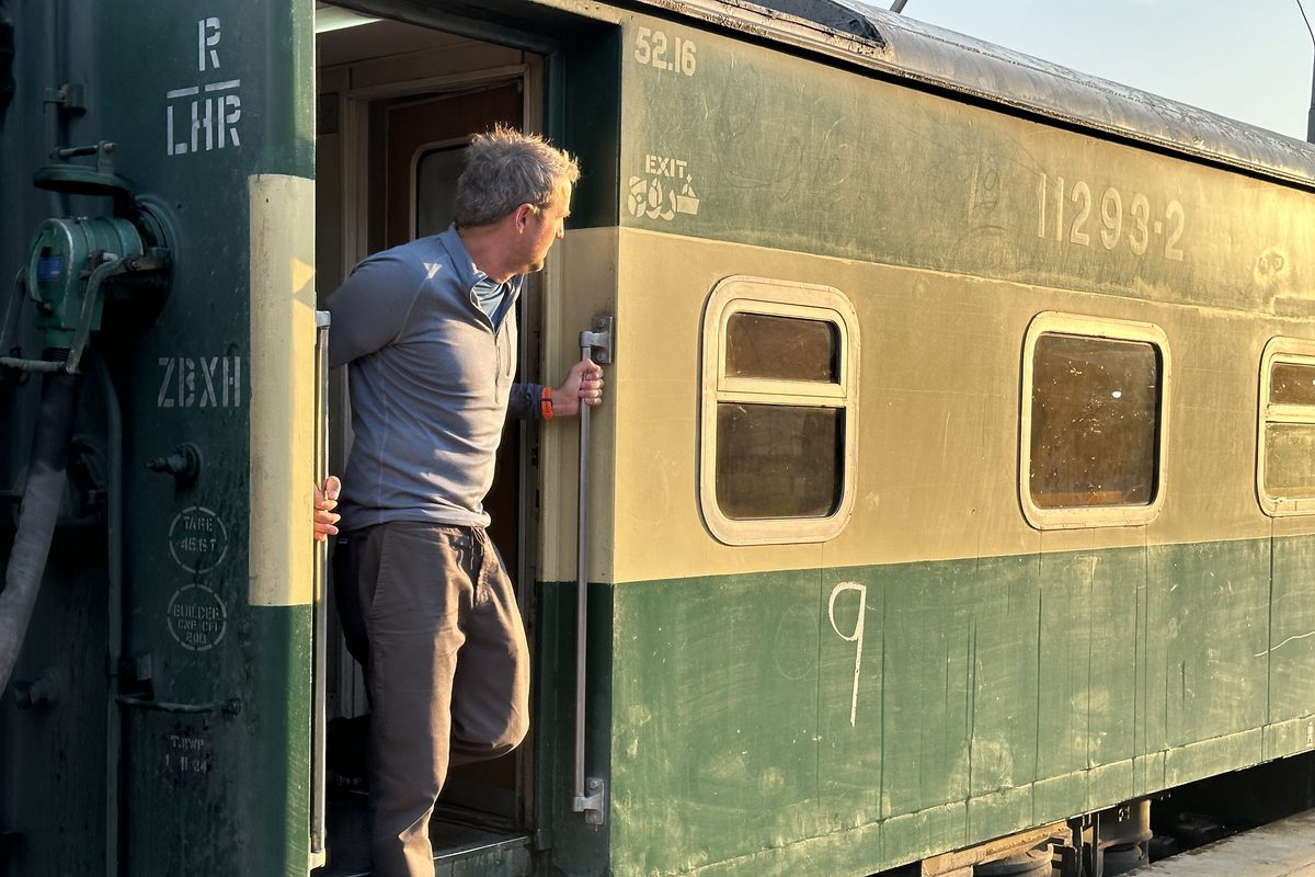 Man stepping off train in India