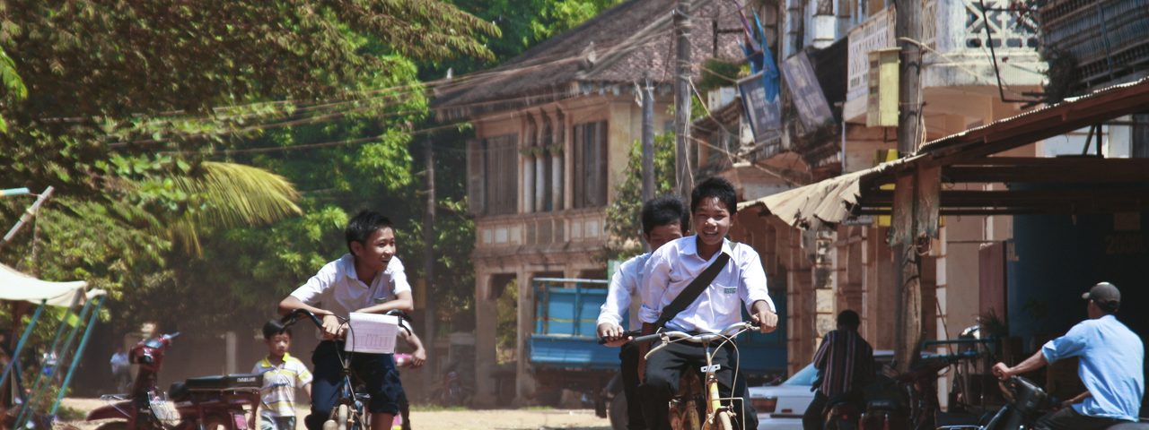 Boys on bikes in Cambodia