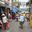 people walking through a street