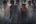 a group of people standing in water