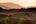 a landscape with trees and mountains