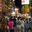 a crowd of people walking on a street
