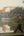 a man walking on a dock near a body of water