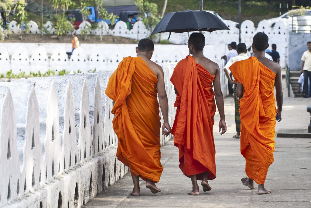 Monks in orange robes in Kandy