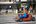 a person driving a go cart on a street