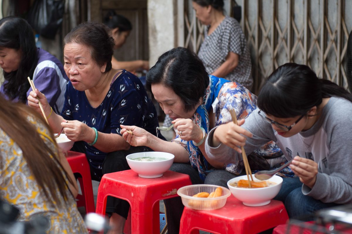 Women eating noodles