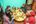 a group of people sitting around a table eating food