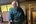 a man in a blue robe