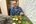 a man sitting at a table with food on it