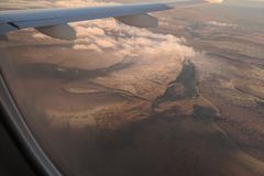 an airplane wing and landscape