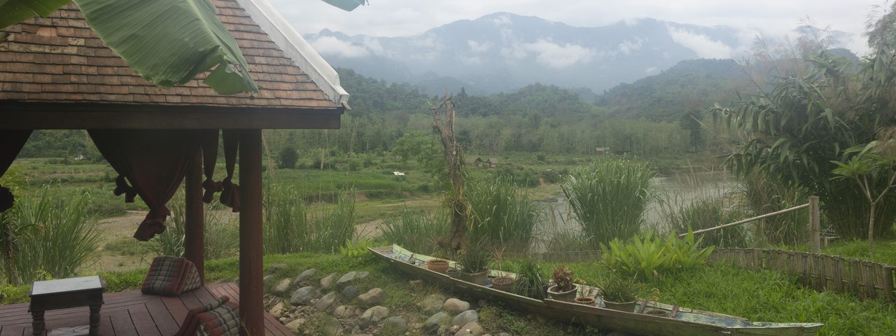 Looking over misty hills from a property in Laos