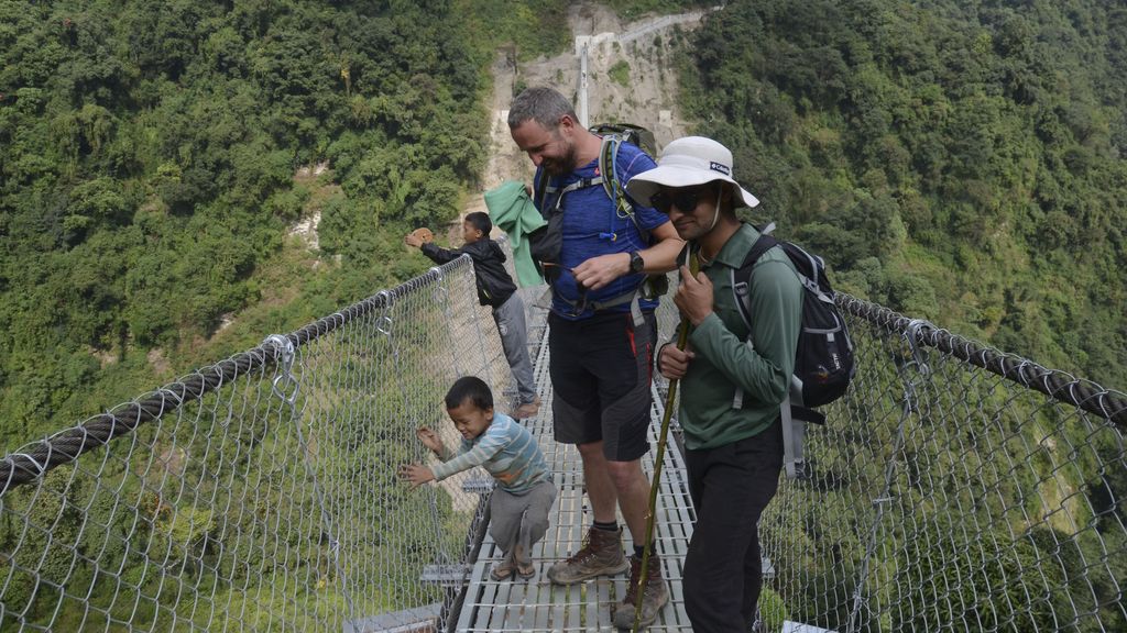 Guide and tourist on bridge