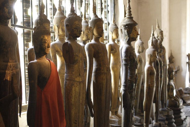 a row of statues in a room