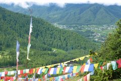 a group of colorful flags on a hill