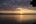 a sunset over a lake