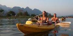 a group of people in a canoe