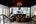 a room with a chandelier and a car in the background