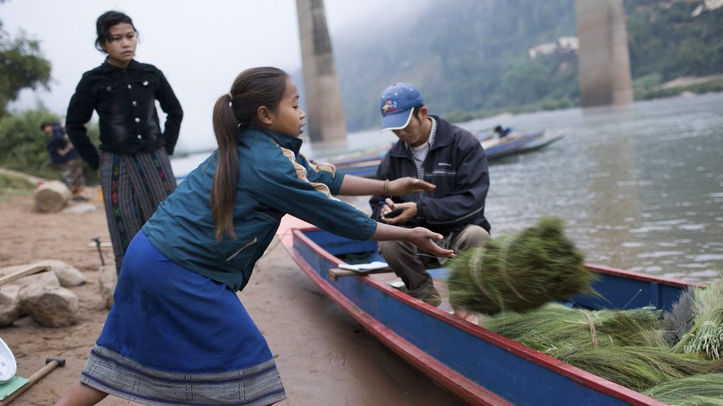 People by the riverside in Laos