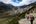 a couple of people hiking in a valley