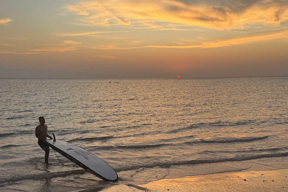 Paddle boarding at sunset