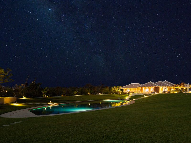 Swimming pool by night at Hoshinoya Taketomi Island