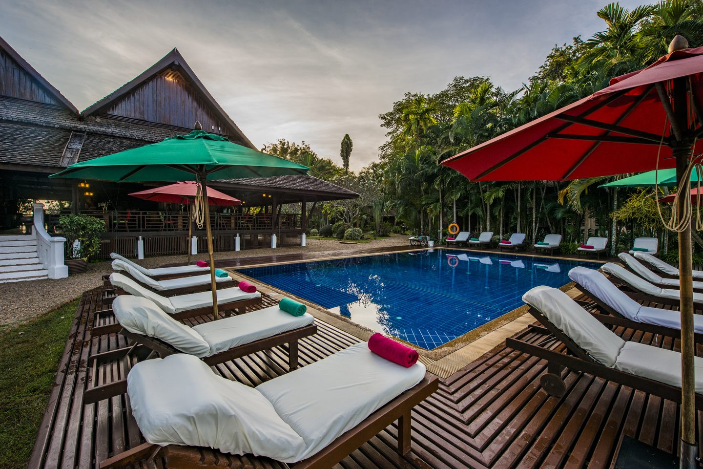 Pool with sun loungers at La Folie