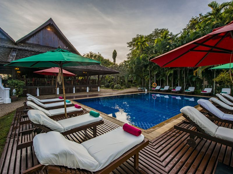 Pool with sun loungers at La Folie