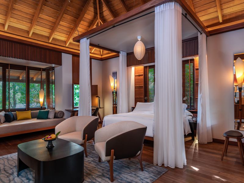 Villa with canopy bed at The Datai