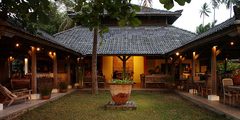 a building with a large pot in front of it