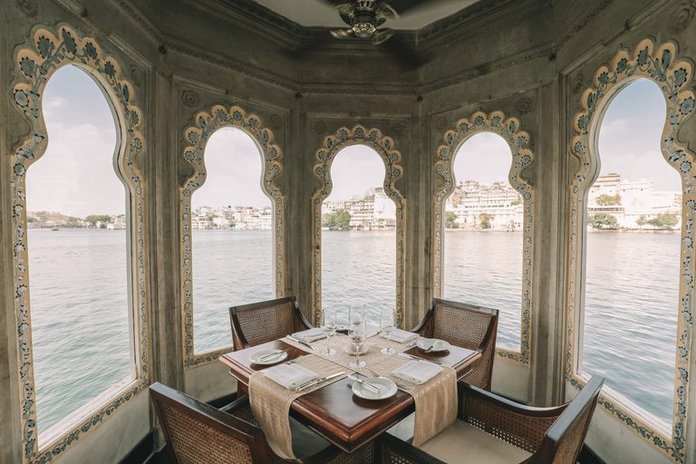 a table set for a dinner on a boat
