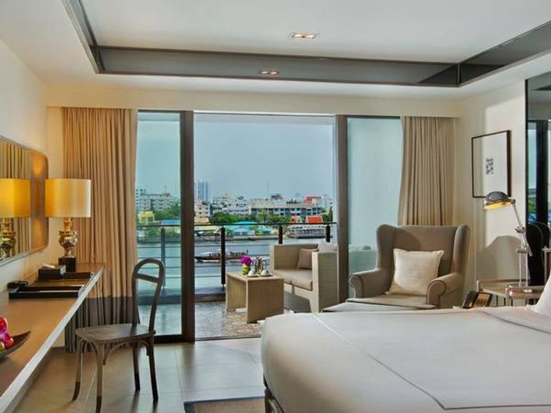 Bedroom at Riva Surya overlooking river