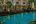 a swimming pool in front of a building