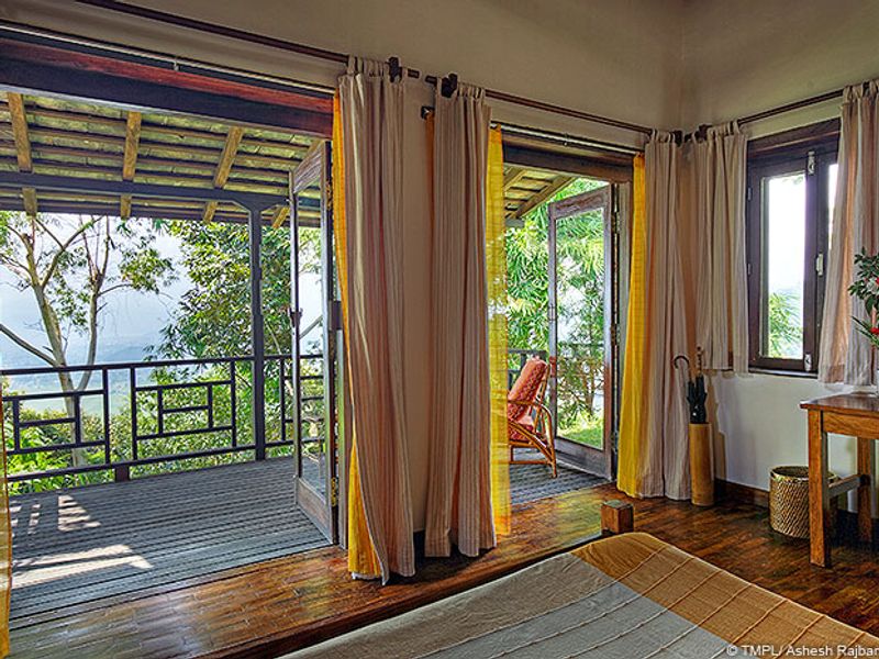 Room with veranda overlooking forest
