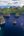 a body of water with islands and a boat