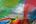 a group of colorful flags in a field