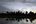 a body of water with trees in the background