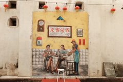 a mural of a couple of people sitting at a table