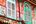 a colorful building with shutters