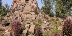 a stone structure with a flag on it