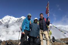 a group of people standing on a mountain top