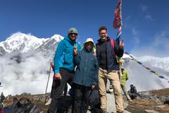 a group of people standing on a mountain top