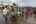 a group of people in a street with a cart full of fish