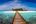 a wooden walkway leading to an island