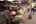 a woman selling vegetables at a market