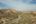 a dirt road through a desert