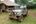 a military jeep parked in a grassy area